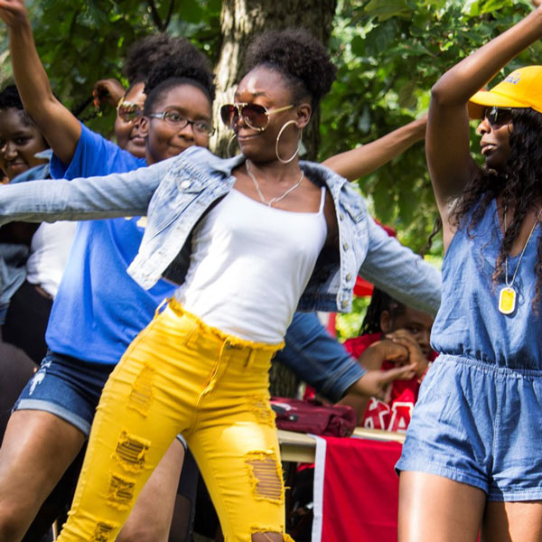 African American students dance at welcome week.