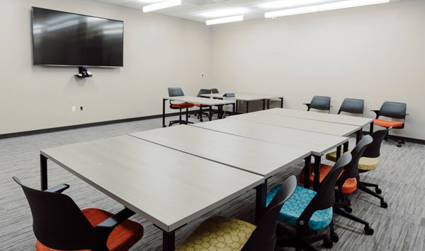 Large conference room with seating and screen.